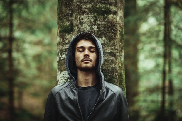 YOUNG MAN IN A FOREST