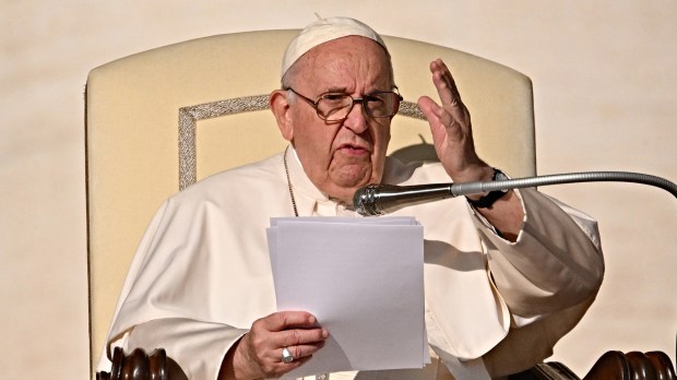 Pope-Francis-waves-as-he-arrives-for-the-weekly-general-audience-AFP