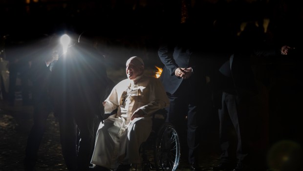 Pope Francis stops in front a nativity scene in St. Peter's Square after presiding over the first Vespers and the 'Te Deum'
