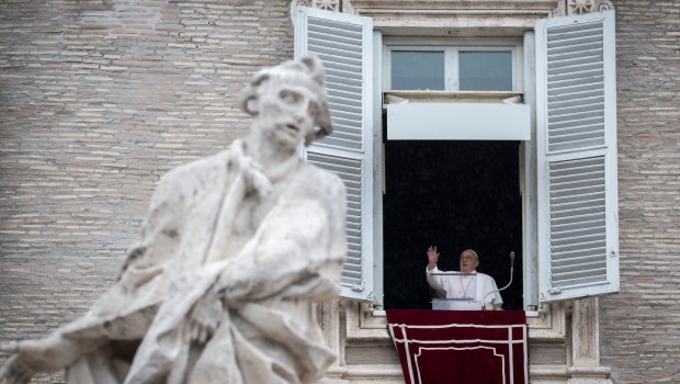 Pope Francis addresses the crowd from the window of the apostolic palace overlooking St. Peter's square during the Regina Coeli prayer on May 19, 2024 in The Vatican.