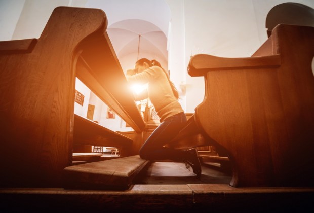 Christian woman praying in church