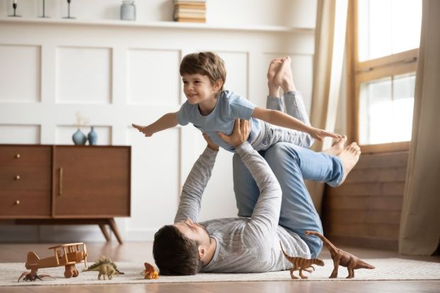 father playing with his son