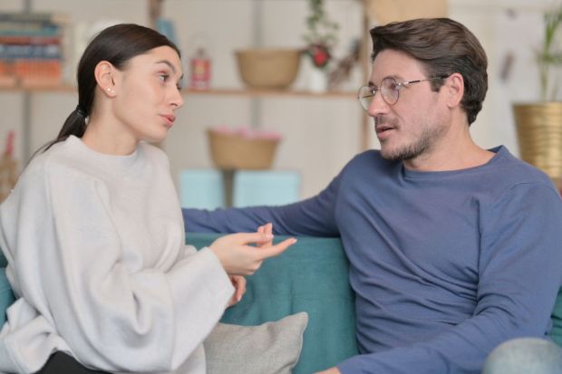 couple talking in the couch