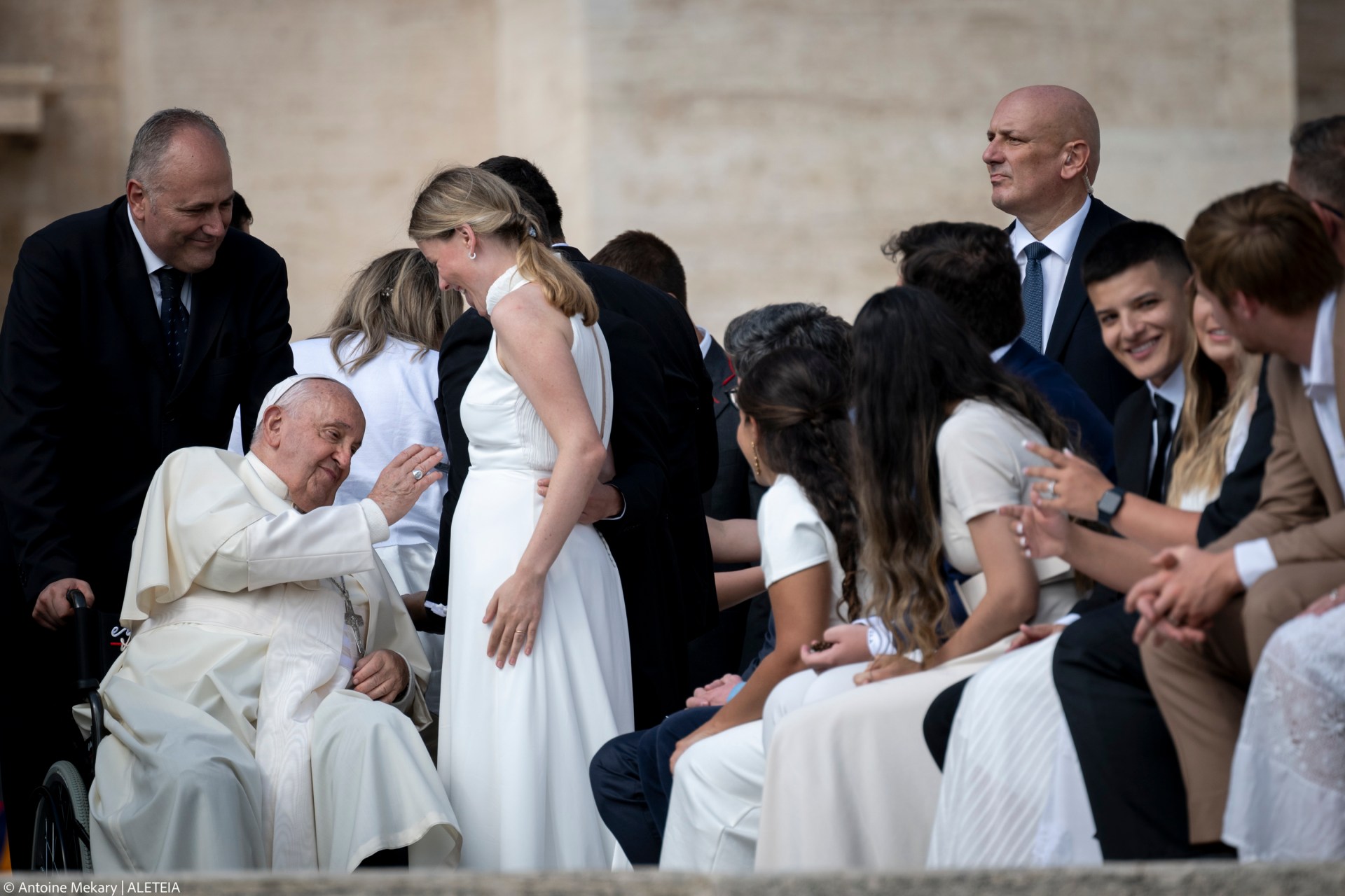 Pope Francis blesses a pregnant woman