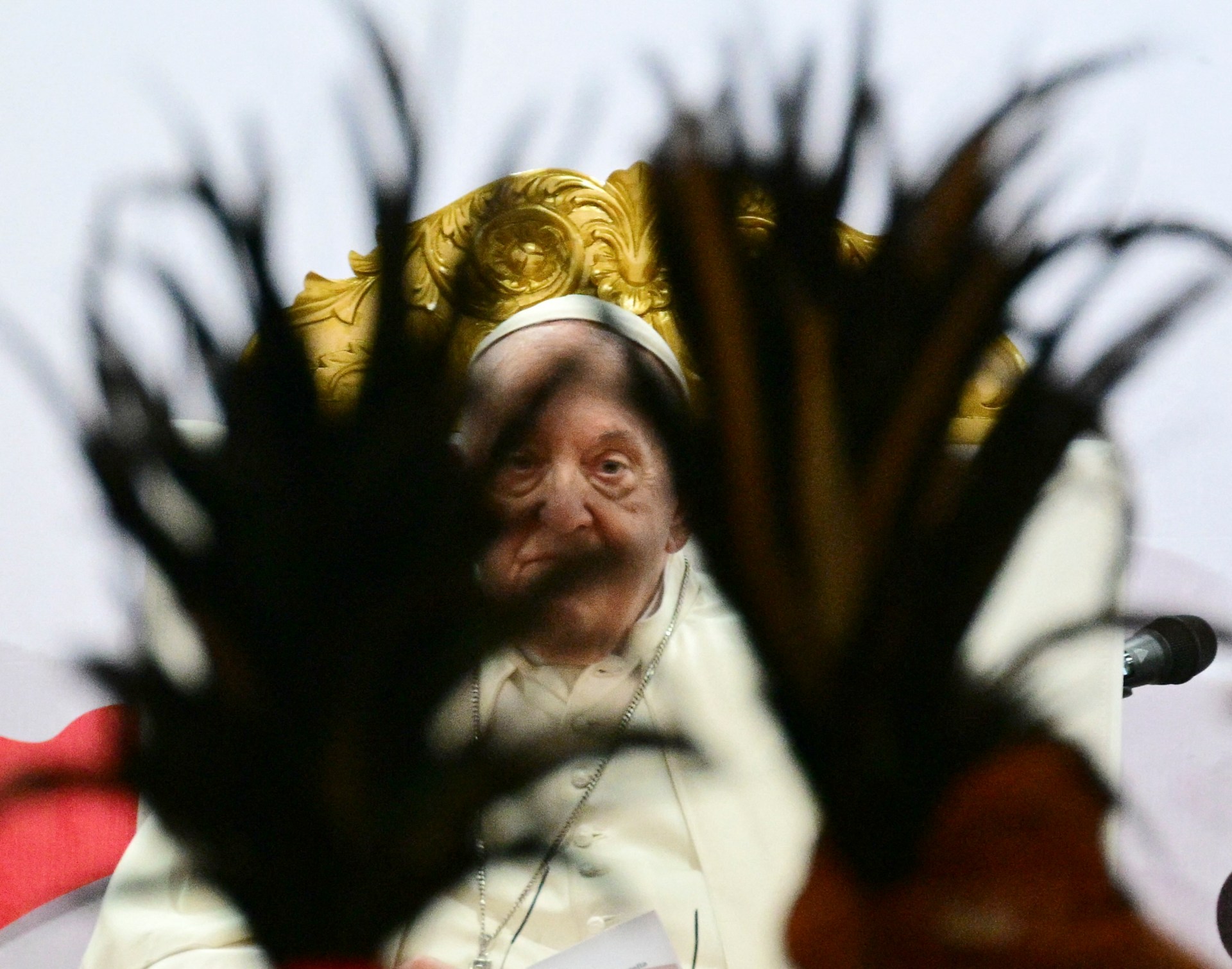 Pope Francis watches dancers as he meets with young people in Centro de Convercoies in Dili, East Timor on September 11, 2024.