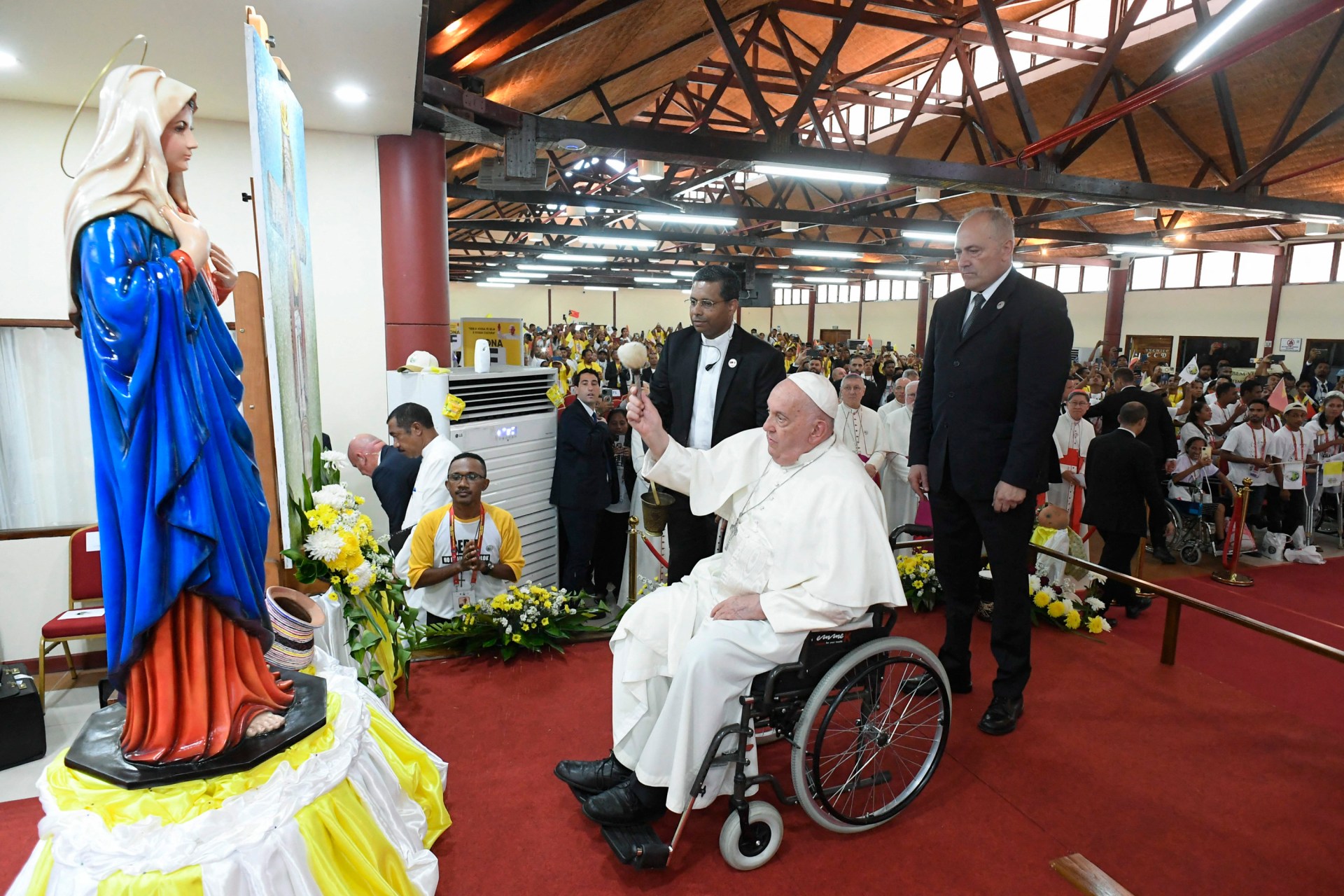 Pope Francis (C) meeting with young people at the Centro de Convercoies in Dili