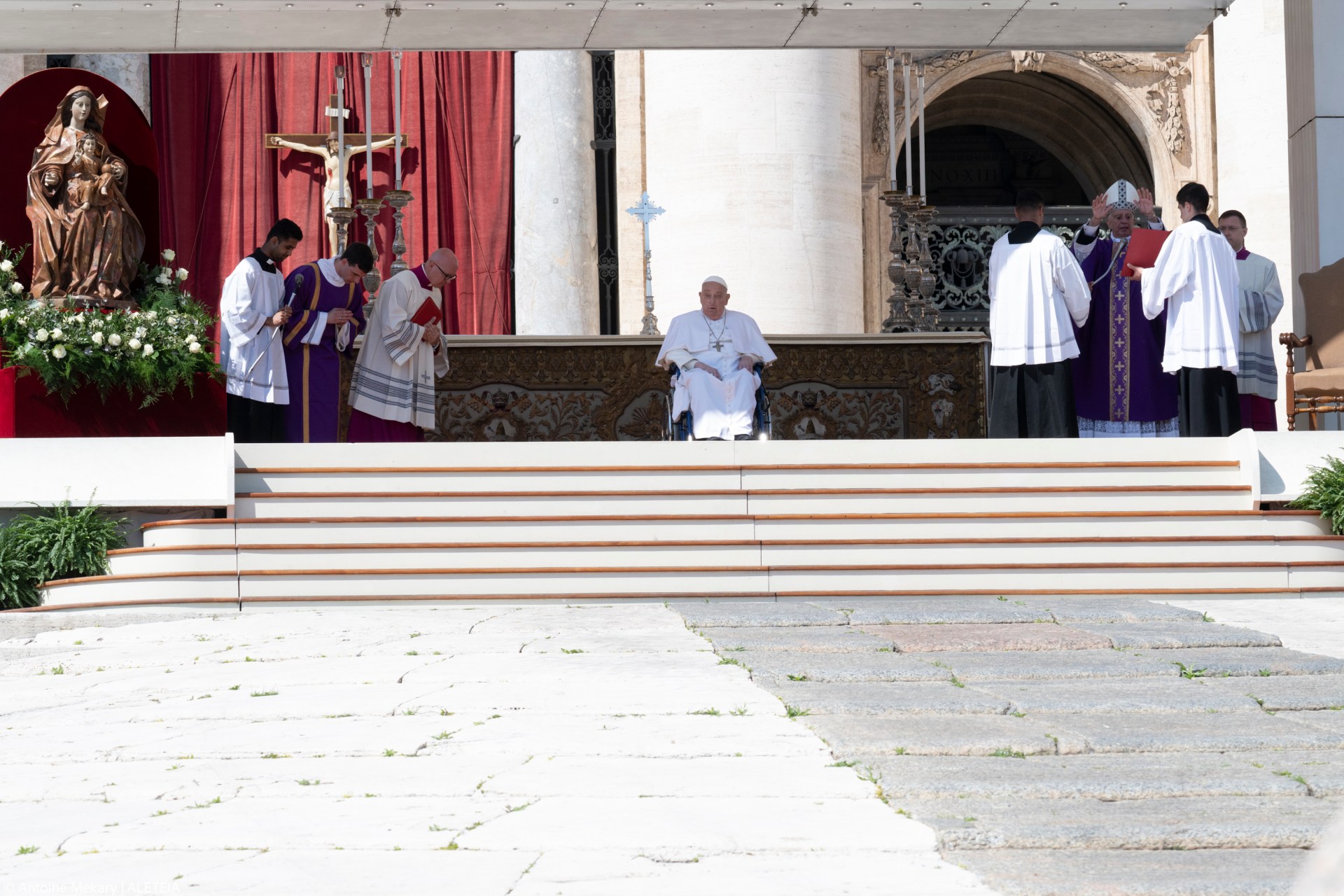 Pope Francis is pushed in a wheelchair on St. Peter's square to conduct the Angelus prayer in The Vatican, on April 6, 2025.